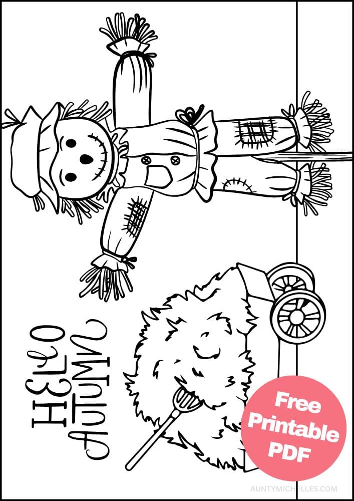 autumn themed coloring page of a cute scarecrow standing in front of a cart full of hay